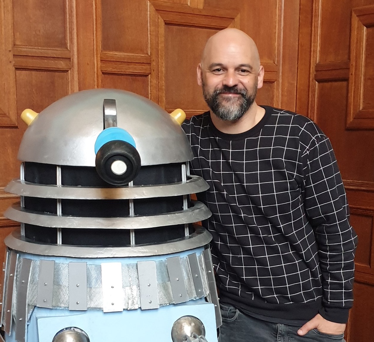 Conrad looking adorable next to a Dalek