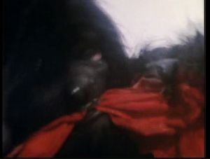 Basically a man in a gorilla suit chewing on some cloth