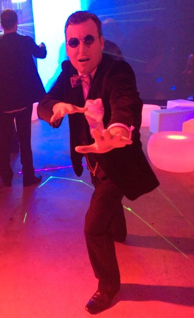 Simon Moore looking Doctorish in some kind of nightclub or something