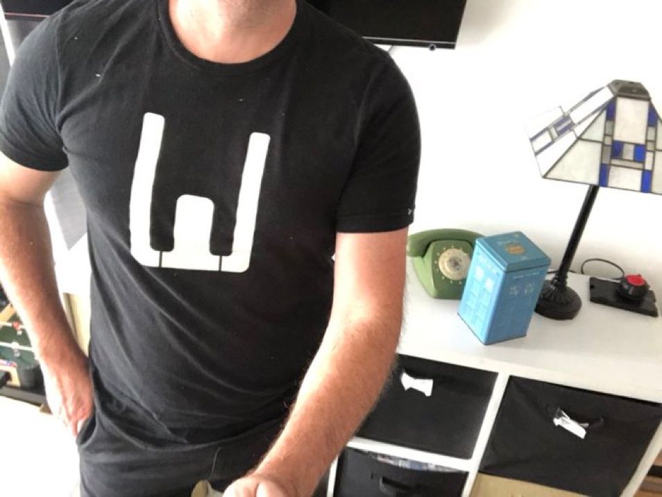 A headless Johnny Spandrell wearing a WOTAN T-shirt